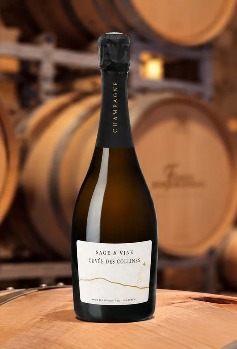 Sage & Vine, Cuvée des Collines, a personalized label on a Fabien Bergeronneau cuvée, standing on a barrel in the cellar